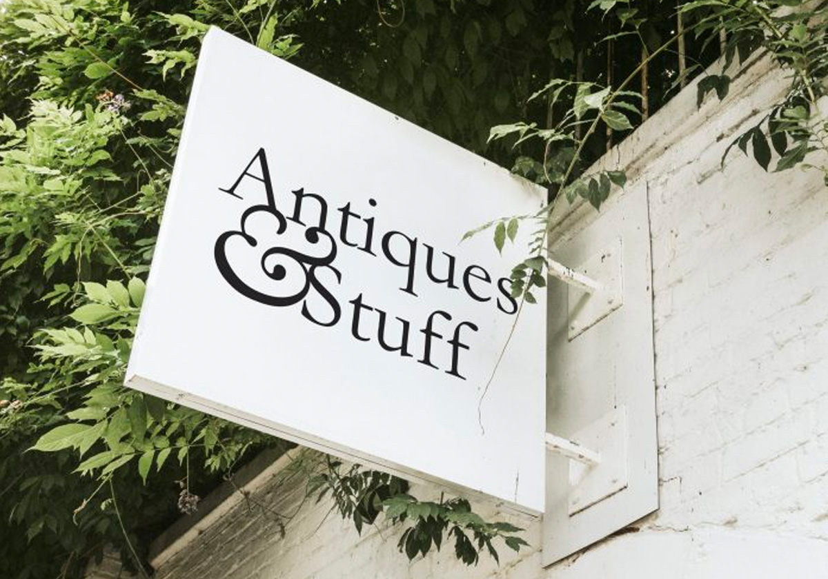 Image of Antiques & Stuff logo on a wall sign