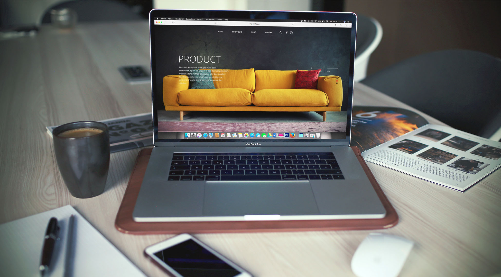 Open laptop with a website showing a couch